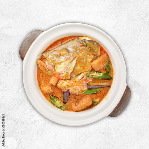 chef cook home style nyonya spicy curry grouper fish head with vegetables in big clay pot asian Chinese banquet halal seafood steamboat cafe restaurant menu photo