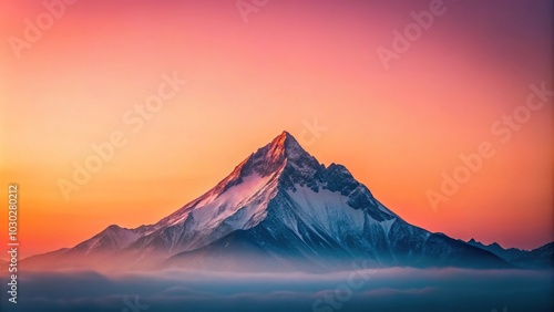 Vertical landscape with sunlit peak at sunset and pink sky