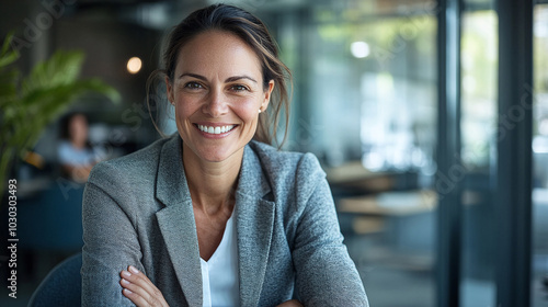 Confident smiling middle aged business woman attorney, 45 or 50 years old lady entrepreneur, mature female professional executive manager leader sitting in office looking at camera. Portrait
