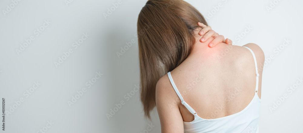 Fototapeta premium Woman having Neck and Shoulder pain at home. Muscle painful due to Myofascial pain syndrome and Fibromyalgia, rheumatism, Scapular pain, Cervical Spine. ergonomic concept