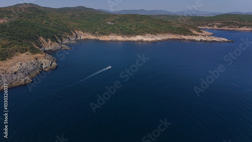 Tourist Boat next to the rocks