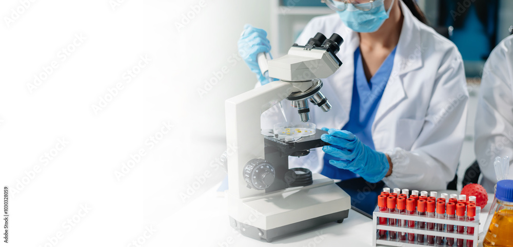 Scientists Analyzing Virus Models in Research Lab Using Digital Tablet and Microscopes Scientists Analyzing Virus Models in Research Lab Using Digital Tablet and Microscopes