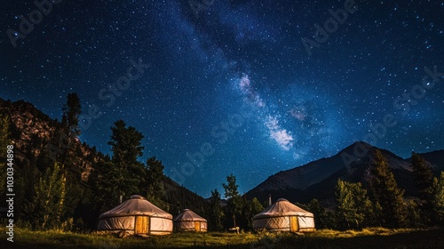 Summer yurts in Nalati meadows, with a starry sky above, ideal for nighttime photography photo