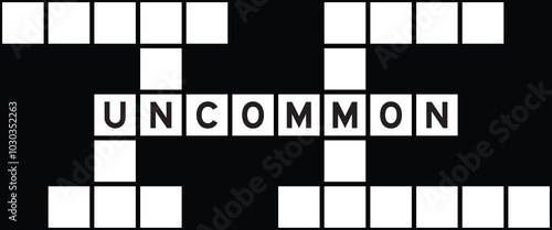 Alphabet letter in word uncommon on crossword puzzle background