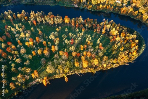 Obraz na płótnie Colorful sunrise over the Gauja National park valley. Sigulda city panorama from drone with forest in autumn colors. w salonie