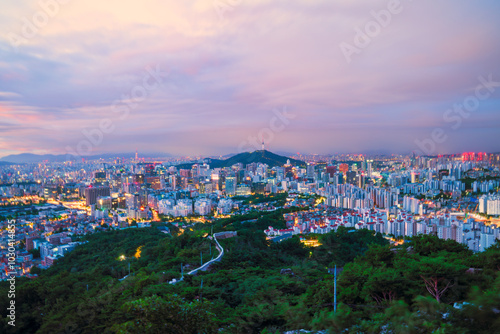 Jongno-gu, Seoul, South Korea at dawn. Bird's-eye view of Seoul Fortress on Inwangsan Mountain with Seoul in the background.