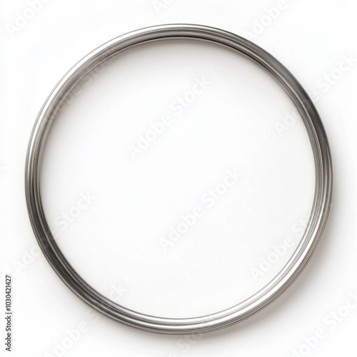 Circular metallic ring with a simple silver design on a white background