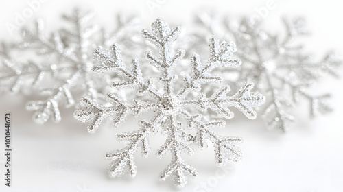 An Exquisite Display of Photo Realistic White Snowflakes Radiating Colorful Crystal Glares Against a Soft White Background