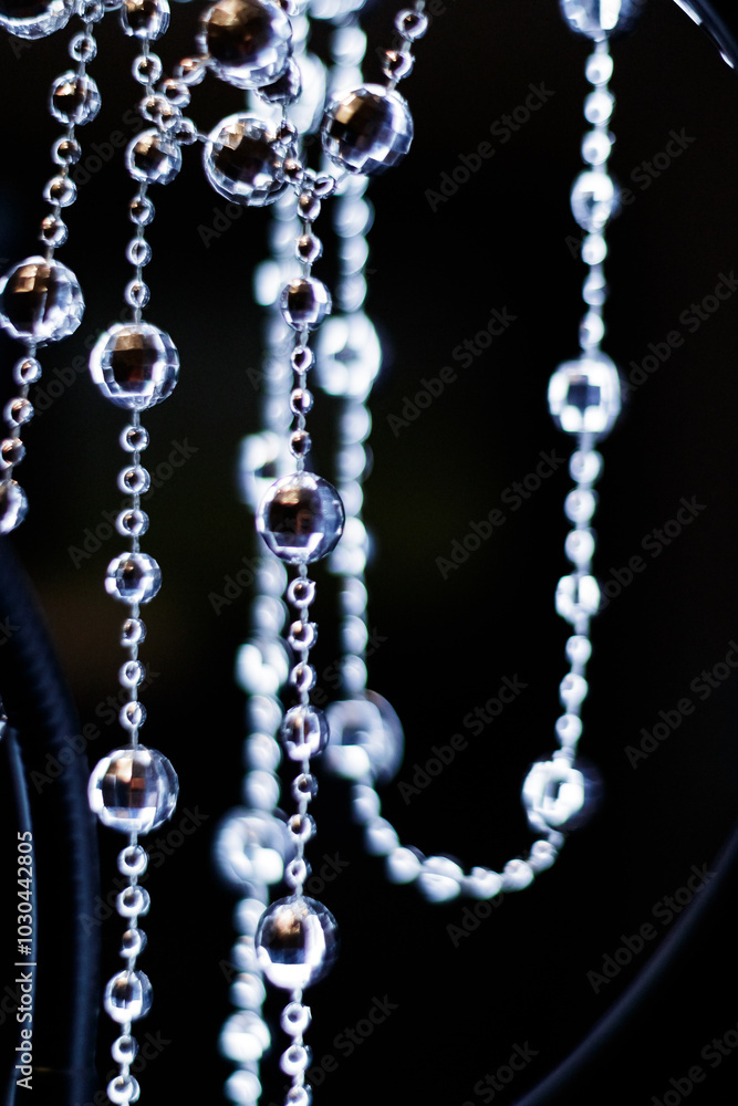Crystal disco beads hanging garland shining on dark background. Christmas, New Year 2025 Crystal disco beads hanging garland shining on dark background. Christmas, New Year 2025