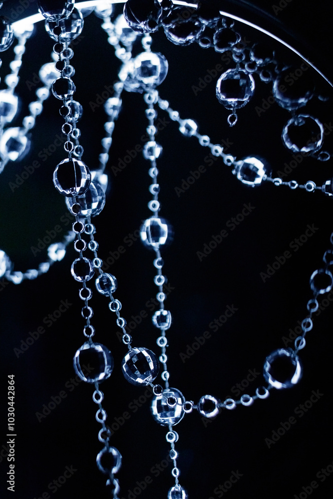 Crystal disco beads hanging garland shining on dark background. Christmas, New Year 2025 Crystal disco beads hanging garland shining on dark background. Christmas, New Year 2025
