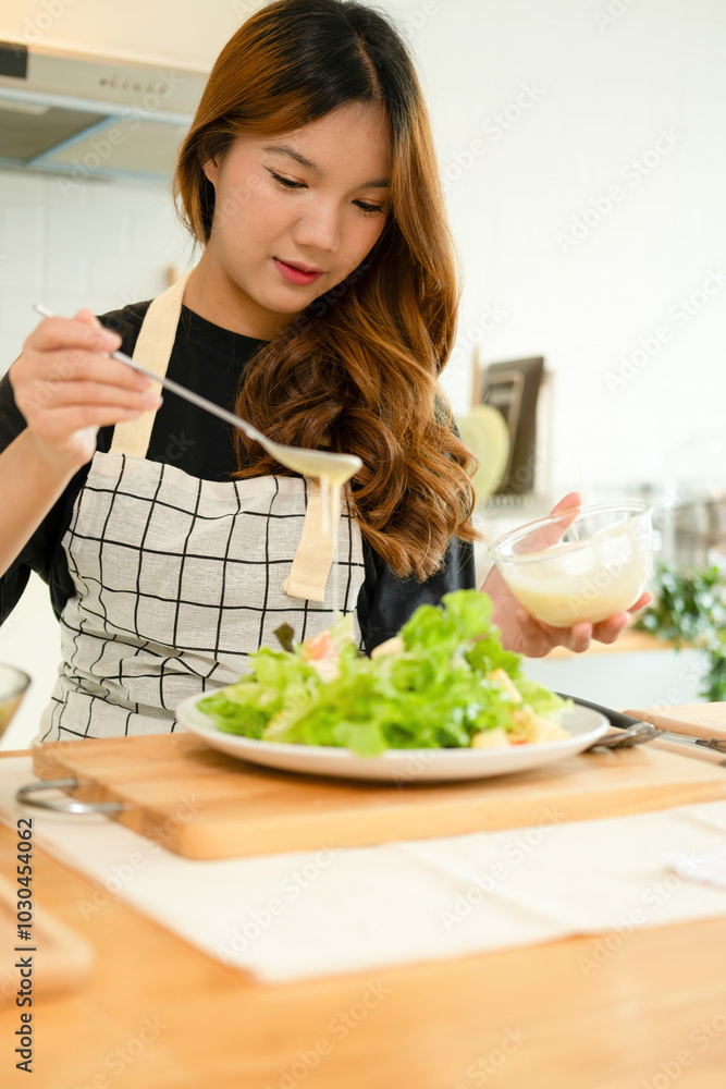 A woman enjoy making salad in the kitchen A woman enjoy making salad in the kitchen