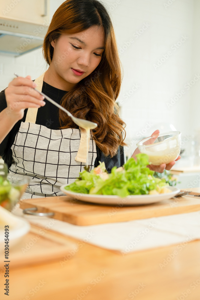 A woman enjoy making salad in the kitchen A woman enjoy making salad in the kitchen