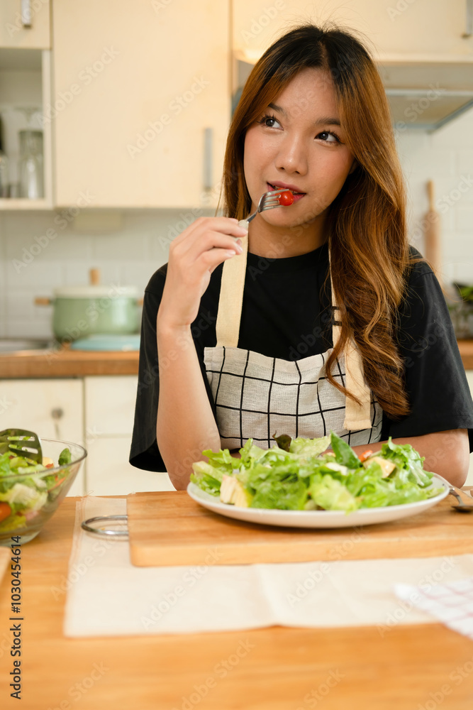 A female homecook enjoying her salad A female homecook enjoying her salad