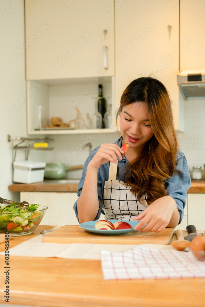 A young woman eating an apple A young woman eating an apple