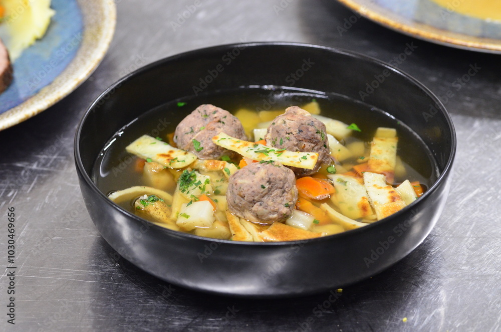 traditional Czech food served in a restaurant, beef or venison cream sauce, dumpling, cranberries traditional Czech food served in a restaurant, beef or venison cream sauce, dumpling, cranberries