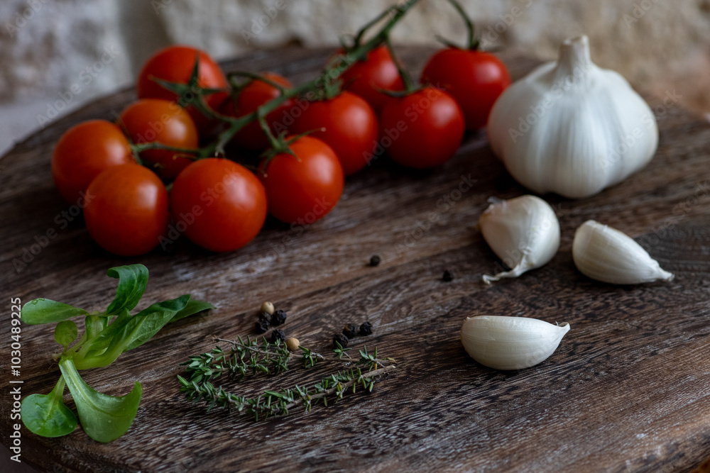 Cherry tomatoes on the wooden cutting board Cherry tomatoes on the wooden cutting board