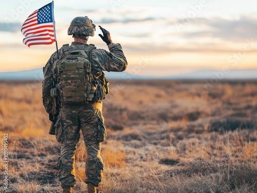 Obraz na płótnie Soldier saluting with American flag in open landscape at sunset w salonie