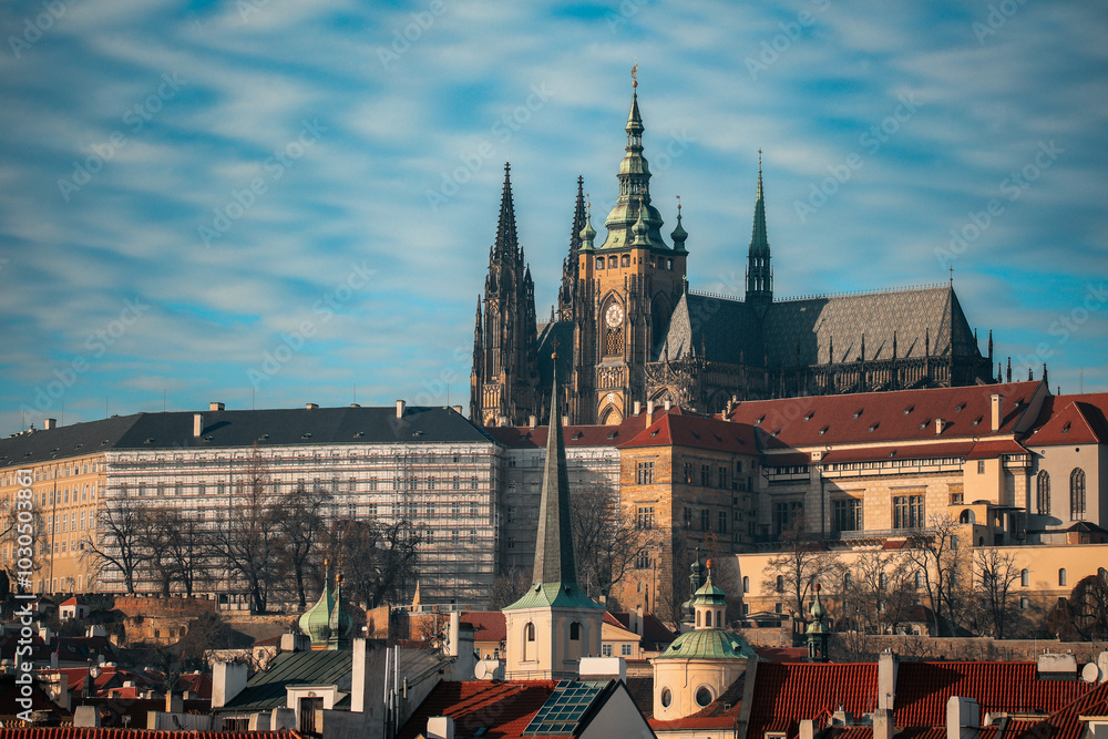 Exploring the historic skyline of Prague, featuring the majestic Prague Castle under a clear blue sky Exploring the historic skyline of Prague, featuring the majestic Prague Castle under a clear blue sky