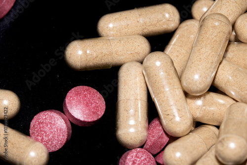 Vitamin Capsules and Pills on a White Background For Medication round and long shaped photo