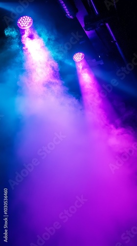 Fog machine producing colorful mist under bright spotlights in a dynamic stage setting