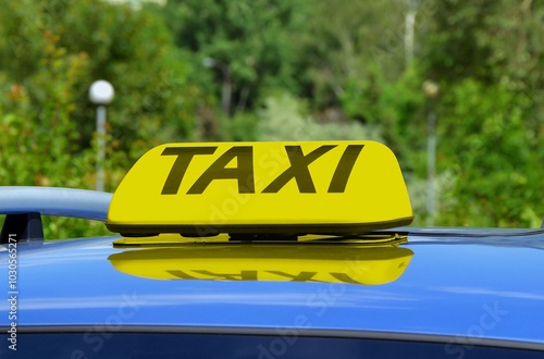 Taxi yellow lamp on the roof of the car. photo