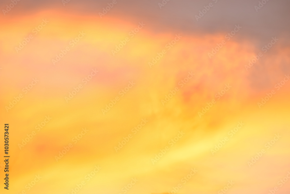 Fototapeta premium A beautiful sky tinted by the sun leaving vibrant shades of gold, pink, blue and multicolored. Clouds in the twilight evening and morning sky. Cloudy sky background in the evening, and during the day.
