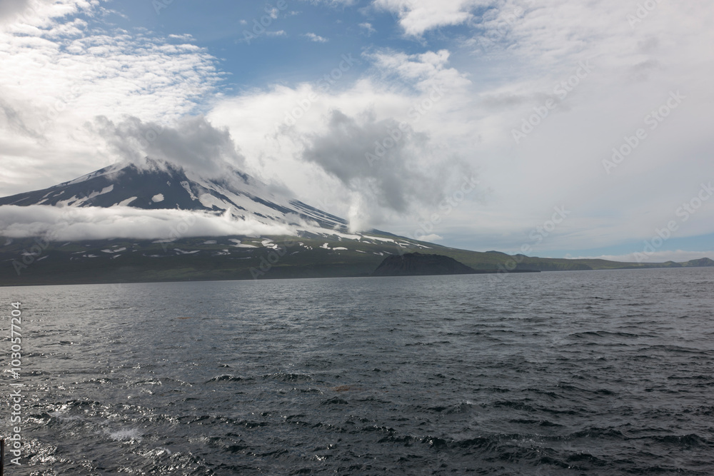 Russia Kuril Islands view from the sea on a sunny summer day Russia Kuril Islands view from the sea on a sunny summer day
