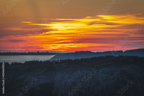 Sunset over Guernsey as viewed from the island of Sark