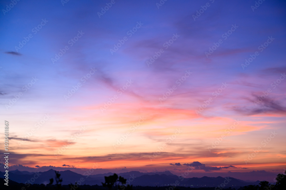 Evening time of panorama mountain under dramatic twilight sky and cloud. Nightfall Silhouette mountain on sunset. Evening time of panorama mountain under dramatic twilight sky and cloud. Nightfall Silhouette mountain on sunset.