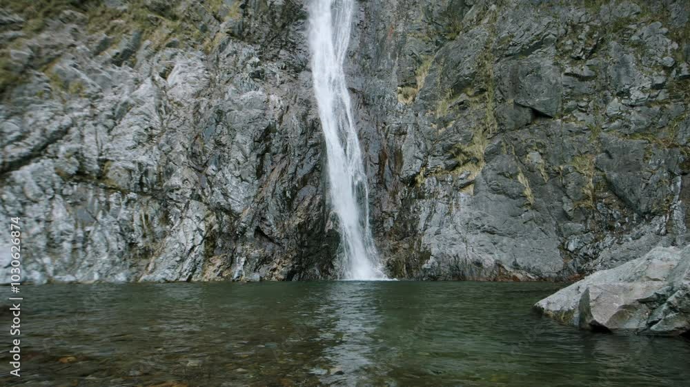 Alpine Waterfall at Sunrise in slowmotion in lake como Alpine Waterfall at Sunrise in slowmotion in lake como