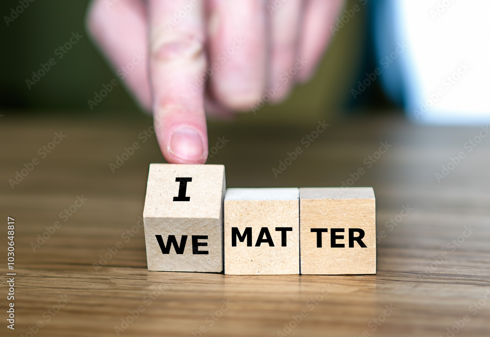 Hand turns cube and changes the expression 'we matter' to 'I matter'. Hand turns cube and changes the expression 'we matter' to 'I matter'.