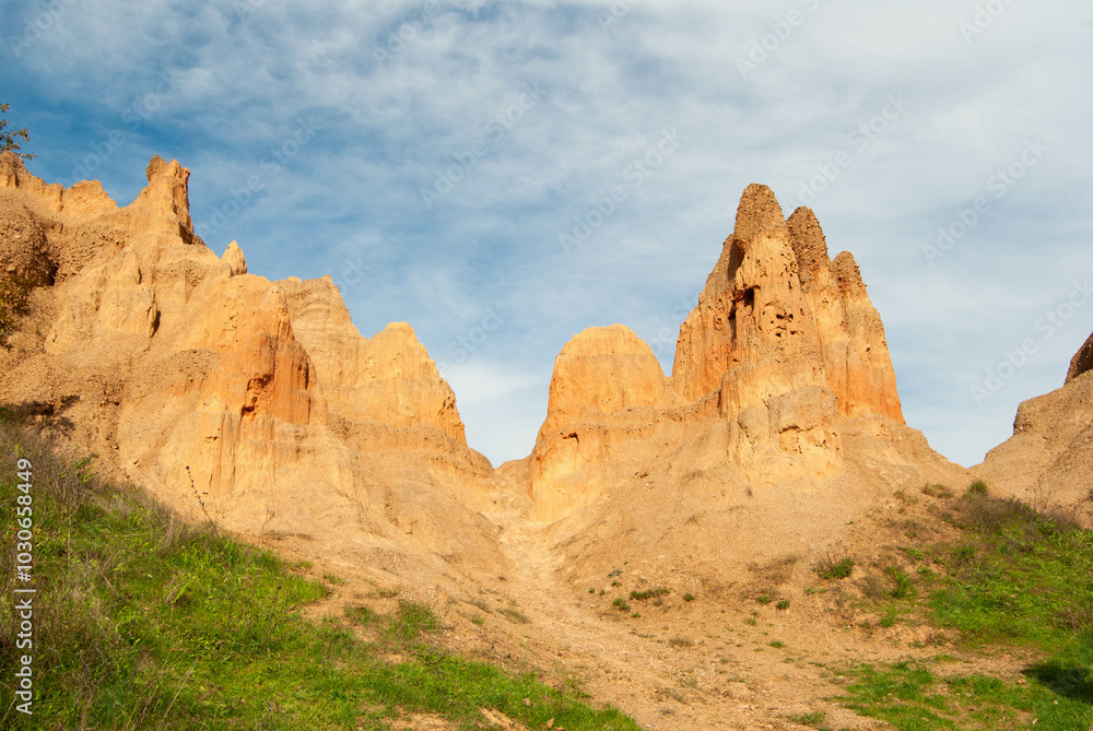 A photo capturing the fascinating natural phenomenon of sand pyramids. A photo capturing the fascinating natural phenomenon of sand pyramids.