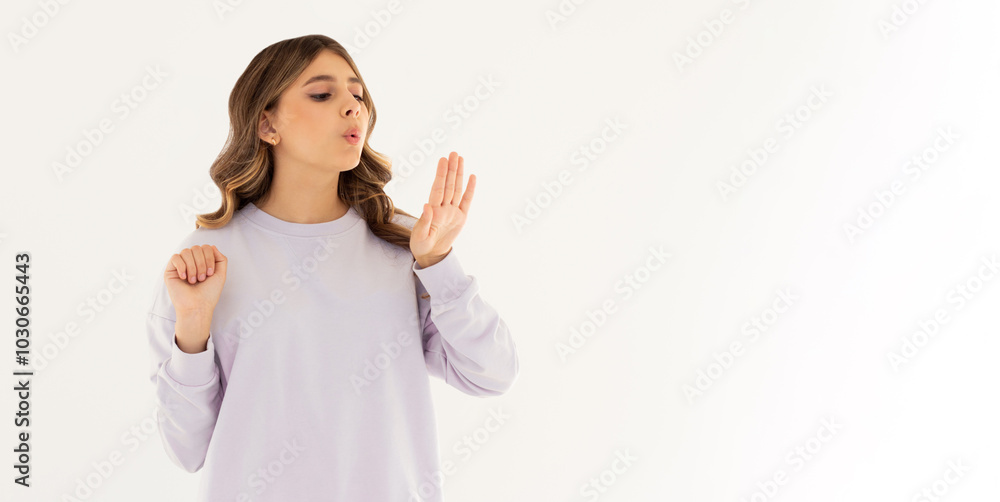 Young caucasian woman looking at manicure on white background Young caucasian woman looking at manicure on white background