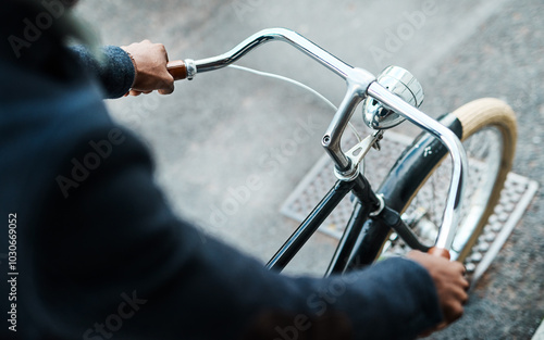 Travel, hands and man with bicycle in city for morning commute, adventure and journey. Transport, cycling and person with bike in urban town for sustainable trip, explore and outdoors on street photo