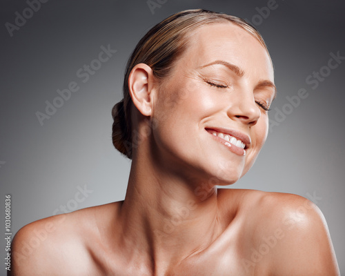 Fotografía Smile, eyes closed and skincare of mature woman in studio for glow, results or beauty on gray background