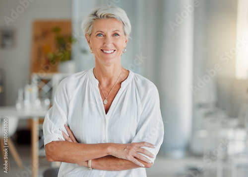 Portrait, mature woman and office with confidence, smile and pride as creative director in business. Female person, happiness and arms crossed as professional in digital agency for career in company