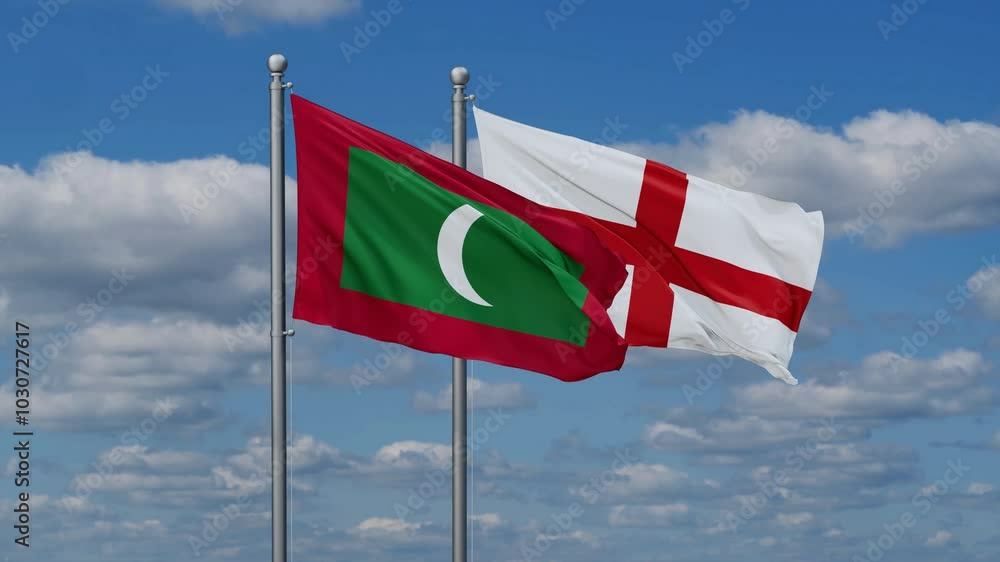 England and Maldives flags flying together, video concept of the relationship, two country relations concept England and Maldives flags flying together, video concept of the relationship, two country relations concept