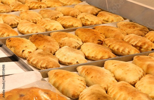 closed stuffed sandwiches called panzerotti typical oven-baked food from Southern Italy photo