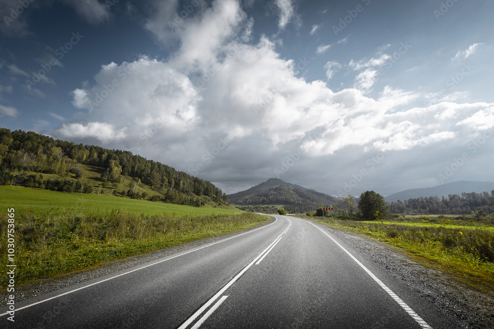 country road in a mountain landscape country road in a mountain landscape