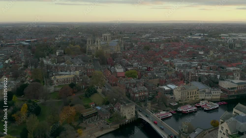 Drone shot capturing the cityscape of York with historic buildings and River Ouse during sunset, England, UK Drone shot capturing the cityscape of York with historic buildings and River Ouse during sunset, England, UK