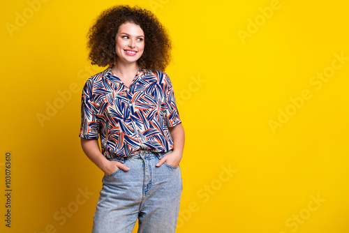 Photo of lovely young lady posing hands pockets look empty space dressed stylish colorful garment isolated on yellow color background