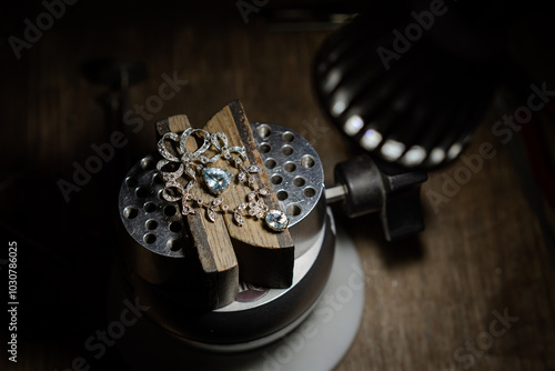 antique brooch repairing. Macro shot. A handmade jeweler process, manufacture of jewelery.