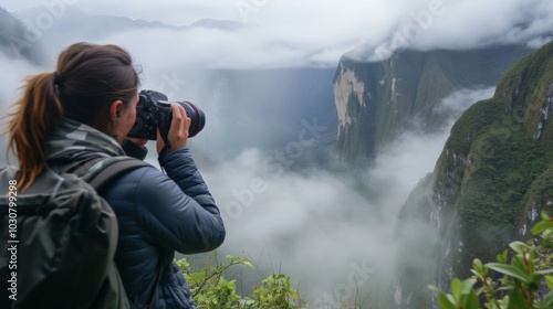 Photographer Capturing the Majestic Foggy Mountain Landscape