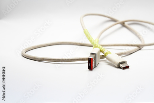 USB cable type C tangled over white isolated background