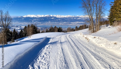 Panoramic View of Snow-Covered Mountains Under a Blue Sky photo