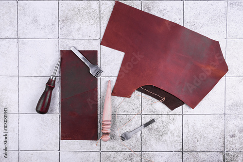 Tanner's workbench. Leather processing tools. Top view. photo