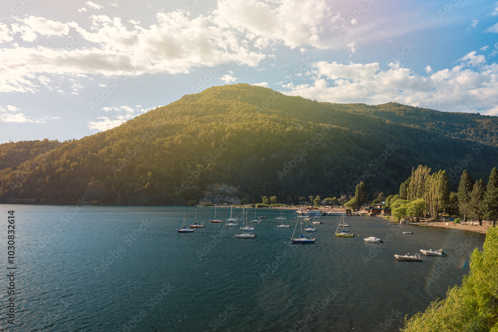 Serene Body of Water with Boats and Hills Against a Beautiful Outdoor Landscape Serene Body of Water with Boats and Hills Against a Beautiful Outdoor Landscape