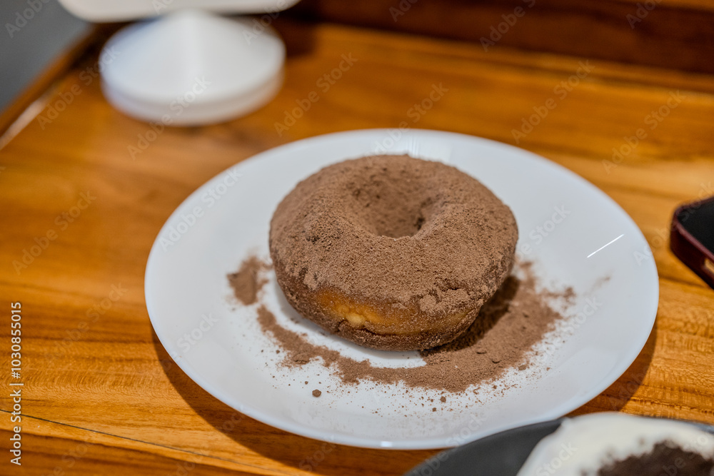 Donut with chocolate powder Donut with chocolate powder