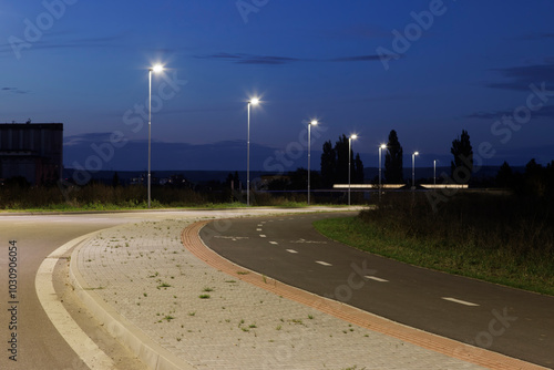 empty road in the night with modern LED street lights
