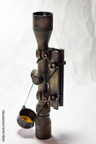 An optical sight for weapons to improve the accuracy of shooting, a device with a mount and optical lenses. Color vertical photo on a white background. photo